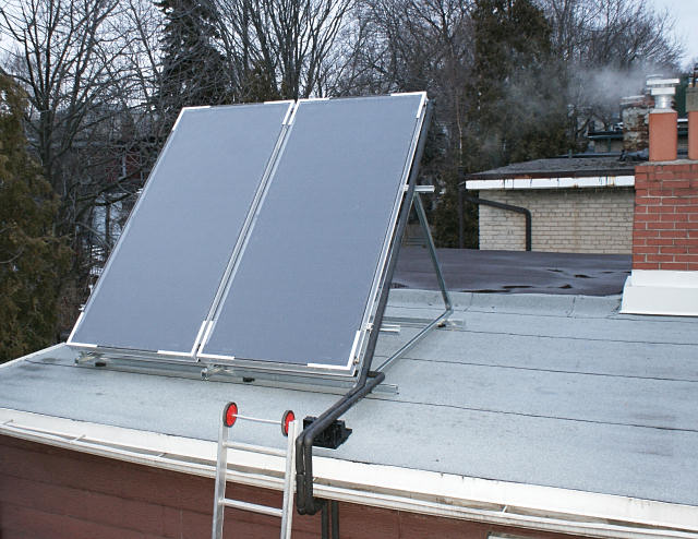 More flat plate solar panels on a Toronto roof