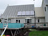 Solar Thermal collectors on large house flat plate solar panels for a large family